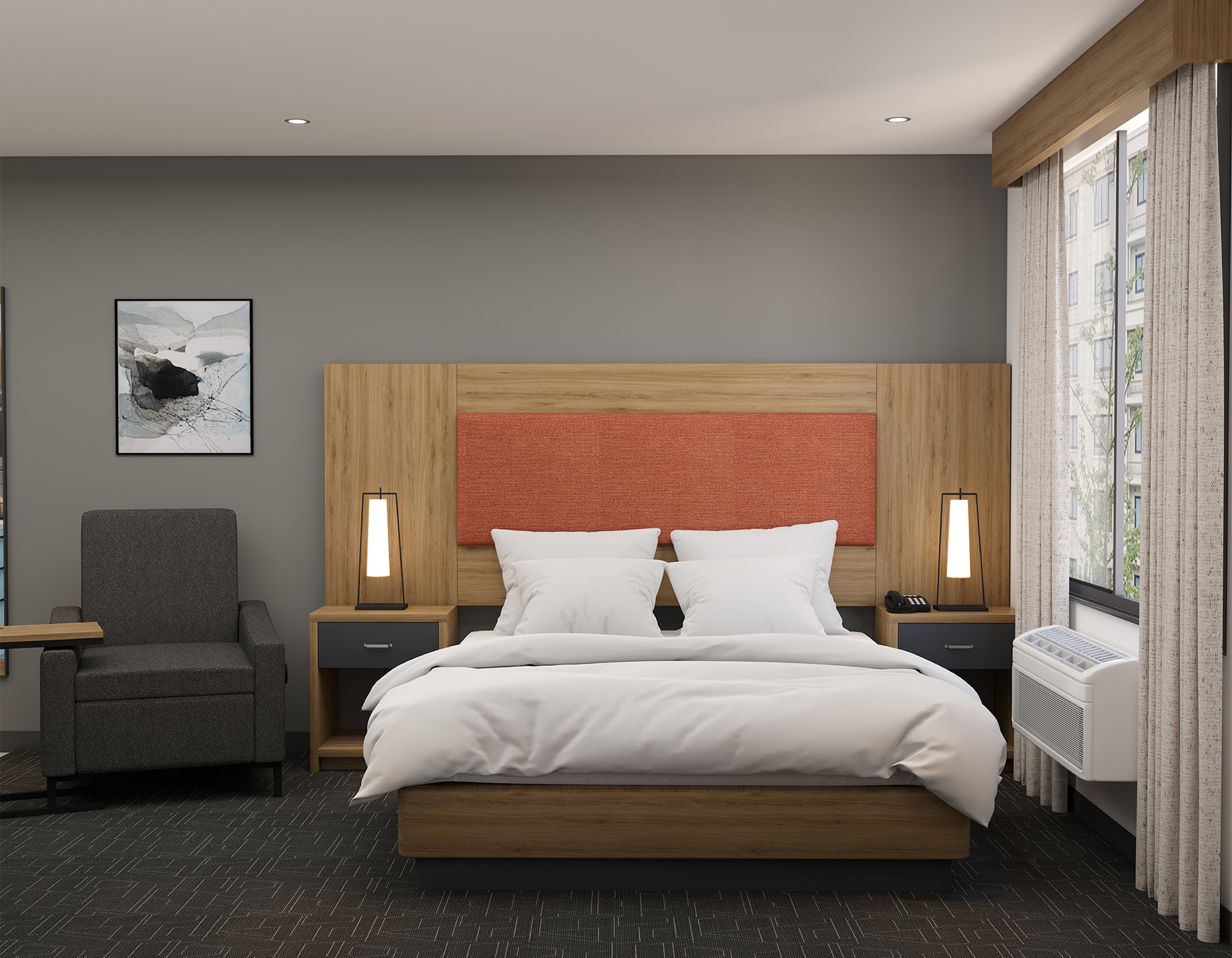 Guest room king bed with coral accent headboard and wall sconces