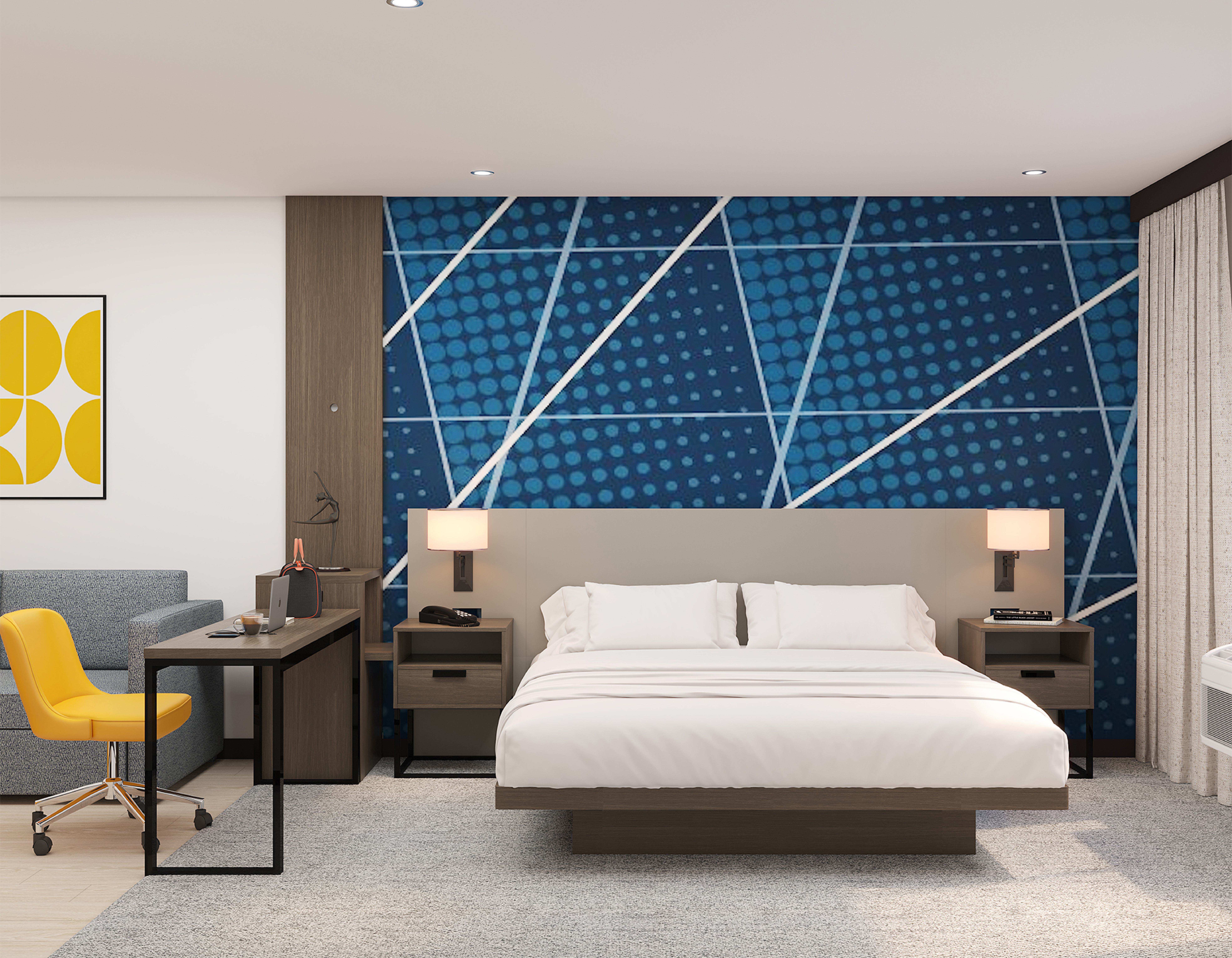 Guest room king bed with geometric dot-pattern accent wall